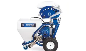 Agregat szpachlarski Graco Texspray APX 6200, gotowy do pracy z materiałem w zasobniku i workiem na górze.