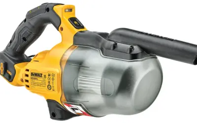 Żółto-czarny odkurzacz DeWalt 18V DCV501L z przezroczystym pojemnikiem na kurz. Idealny do sprzątania w warsztacie.